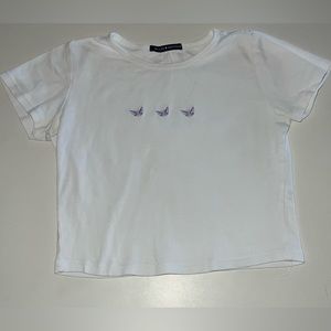 cute butterfly Brandy Melville tee! Worn a lot but I’m very good condition!